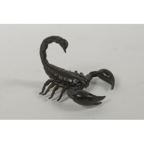 123 - A Japanese style bronze okimono scorpion, indistinct mark to base, 5cm long