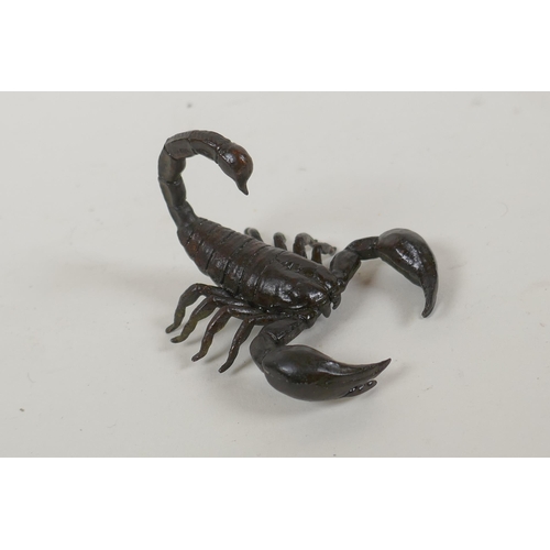 123 - A Japanese style bronze okimono scorpion, indistinct mark to base, 5cm long