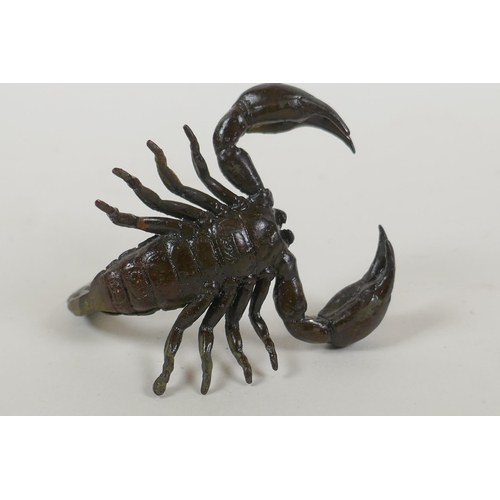 123 - A Japanese style bronze okimono scorpion, indistinct mark to base, 5cm long