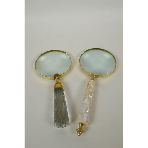 127 - A brass mounted magnifying glass with mother of pearl handle, and another similar with glass handle,... 