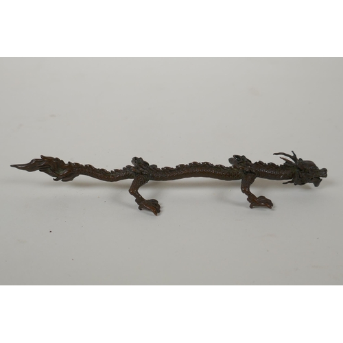 133 - A Japanese style bronze okimono dragon, 16cm long