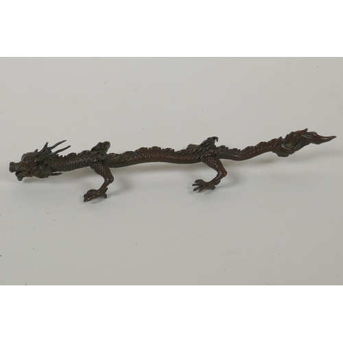 133 - A Japanese style bronze okimono dragon, 16cm long