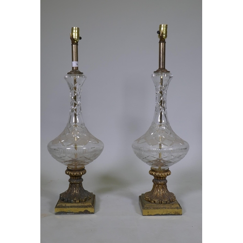 14 - A pair of vintage cut glass table lamps with brass mounts and bases, 76cm high