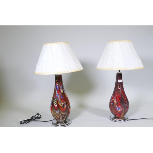 144 - A matched pair of Murano glass style table lamps, with swirled decoration and chromed bases, 55cm hi... 