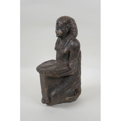 15 - An antique Egyptian carved granite figural statue with a tray of fish, hieroglyphic inscription vers... 