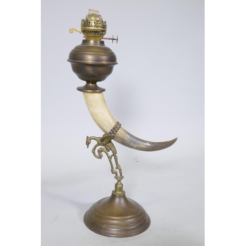 155 - Antique oil lamp with horn body and brass mounts and reservoir, 60cm high