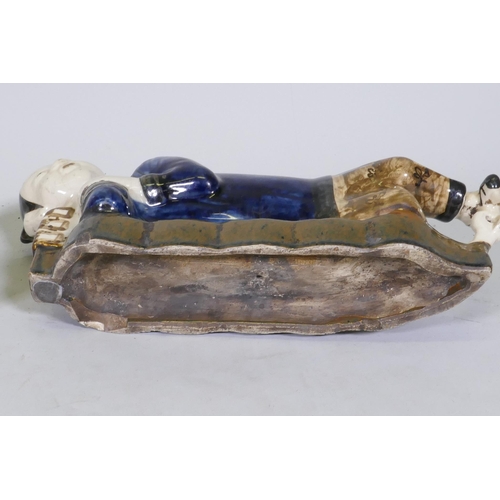 157 - A pair of Chinese ceramic pillows in the form of a recumbent boy and girl, 39cm long