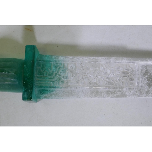 158 - A crystal glass mould of a Chinese dagger with archaic style decoration, 30cm long