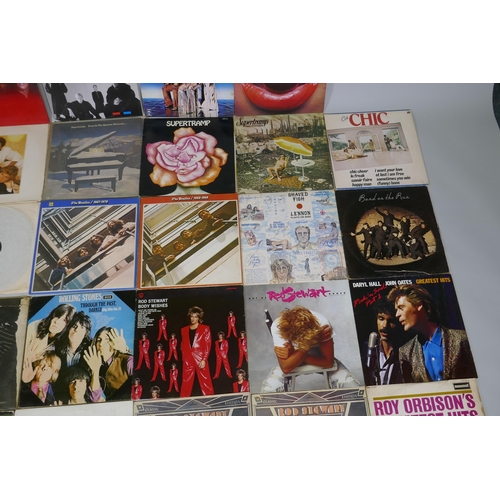 16 - A quantity of 1960s and '70s vinyl LPs including The Beatles 'Rock N Roll Music', 'The White Album',... 