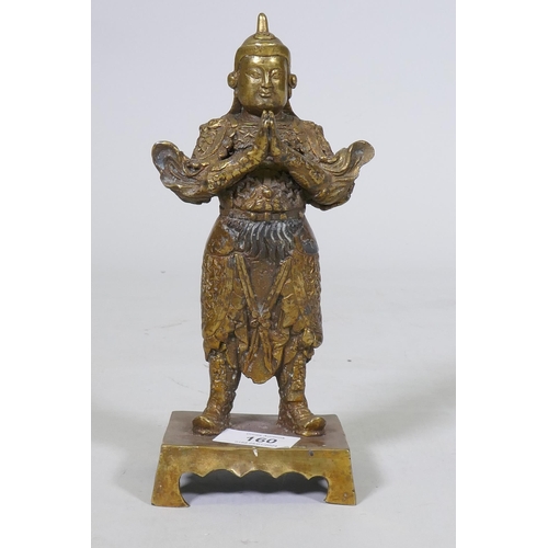 160 - A Chinese bronze figure of a warrior god, hands clasped in prayer, impressed seal mark verso, 23cm h... 