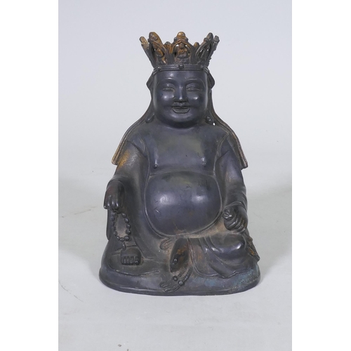 161 - An oriental bronze Buddhivistic seated figure bearing a rosary and ruyi, 23cm high