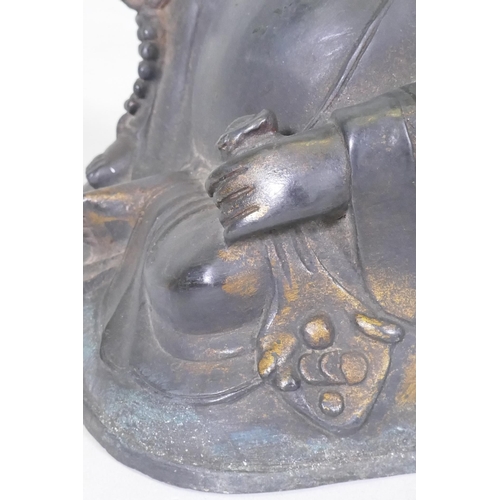 161 - An oriental bronze Buddhivistic seated figure bearing a rosary and ruyi, 23cm high