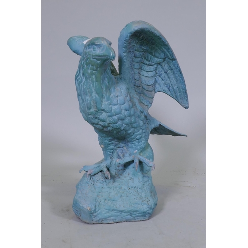 164 - A metal figure of an eagle with verdigris patination, 45cm high