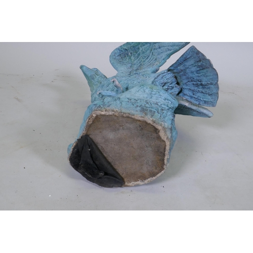 164 - A metal figure of an eagle with verdigris patination, 45cm high