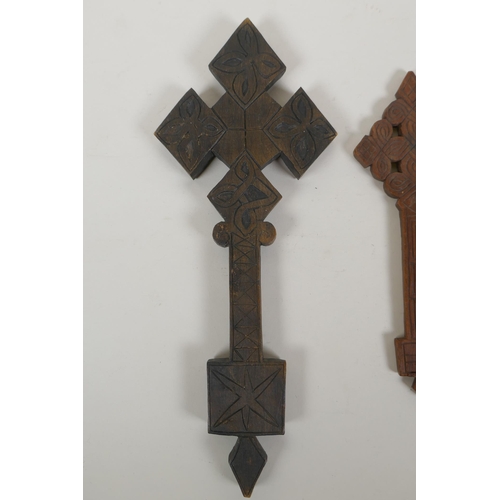 165 - An African carved wood Coptic Cross and another smaller, 31cm 