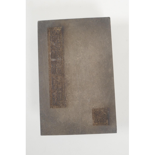 166 - A Chinese wood and silk bound book containing amber hardstone tablets with chased and gilt character... 