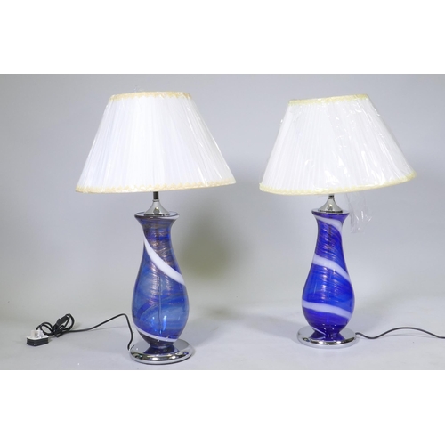 169 - A pair of Murano style blue glass table lamps with swirled and aventurine decoration, mounted on&nbs... 