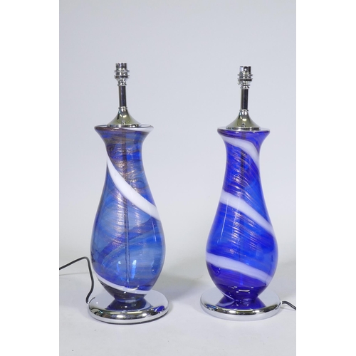 169 - A pair of Murano style blue glass table lamps with swirled and aventurine decoration, mounted on&nbs... 