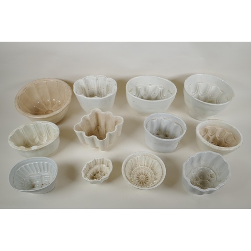 170 - Twelve Victorian pottery jelly moulds of various sizes and shapes, largest 15cm high