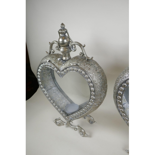 176 - A pair of silvered metal heart shaped lanterns, 51cm high