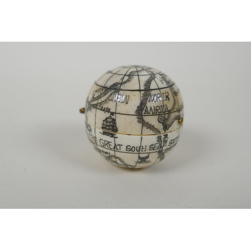 177 - A nautical style carved bone compass and sundial in the form of a globe, 4cm diameter