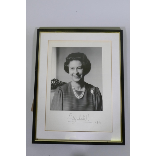 179 - An autographed photo of Her Majesty Queen Elizabeth II, bromide print by John Lawrence, signed Eliza... 