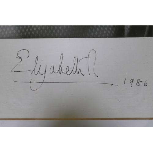 179 - An autographed photo of Her Majesty Queen Elizabeth II, bromide print by John Lawrence, signed Eliza... 