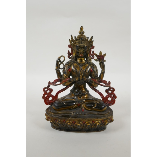 185 - A Tibetan bronze figure of the Buddhist deity Chenrezig, with gilt and painted details, 21cm high