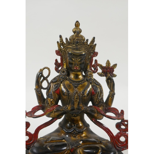 185 - A Tibetan bronze figure of the Buddhist deity Chenrezig, with gilt and painted details, 21cm high