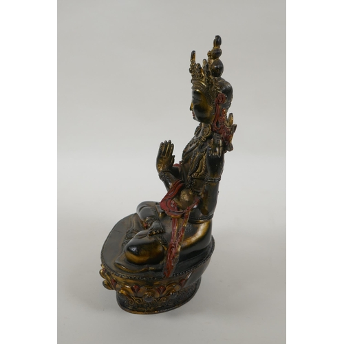 185 - A Tibetan bronze figure of the Buddhist deity Chenrezig, with gilt and painted details, 21cm high