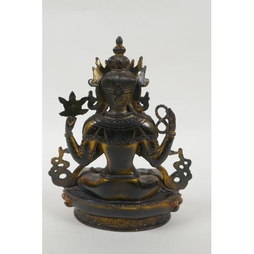 185 - A Tibetan bronze figure of the Buddhist deity Chenrezig, with gilt and painted details, 21cm high