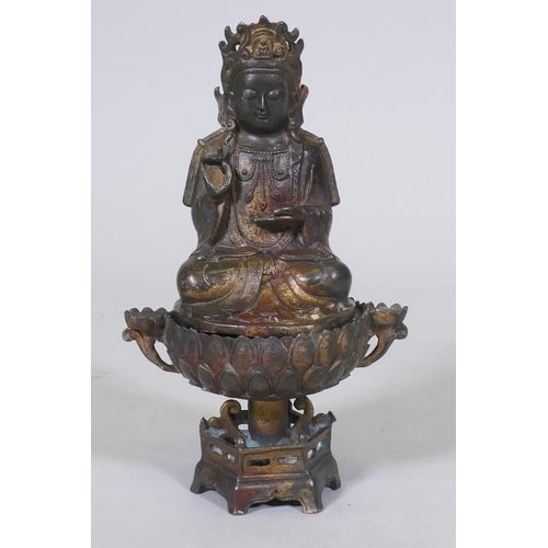 187 - An oriental bronze censer in the form of a lotus with Buddivistic figure 24cm high