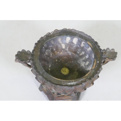 187 - An oriental bronze censer in the form of a lotus with Buddivistic figure 24cm high