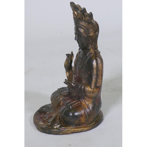 187 - An oriental bronze censer in the form of a lotus with Buddivistic figure 24cm high