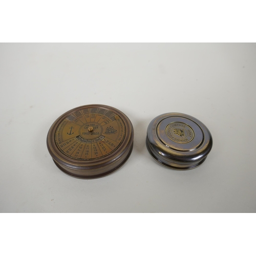 193 - A brass cased 100 year calendar and compass, together with a reproduction 1930s brass marine pocket ... 