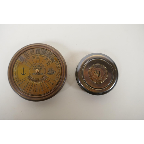 193 - A brass cased 100 year calendar and compass, together with a reproduction 1930s brass marine pocket ... 