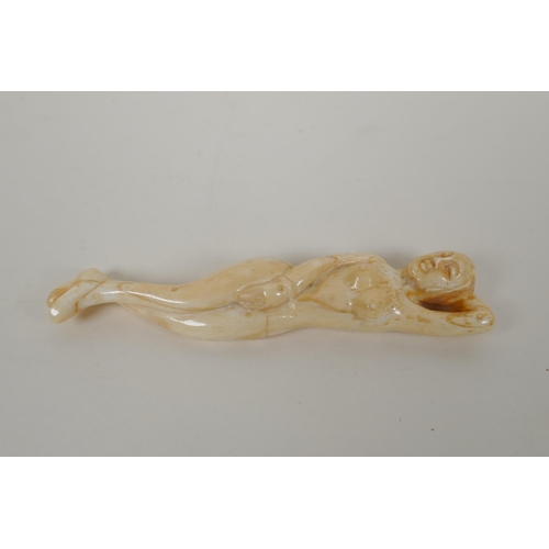 194 - A carved bone figure of a nude, oriental woman, 13cm  long