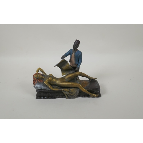 195 - In the manner of Bergmann, a cold painted bronze figure of a Moor and a female nude, 20cm long