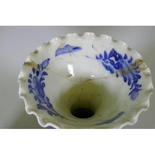 204 - A pair of Arita blue and white vases with flared necks and frilled rims, AF repairs to necks, 45cm h... 