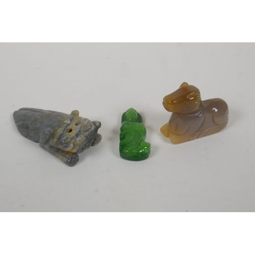 208 - A Chinese apple green jade carved Buddha pendant, an agate carving of a horse and a carved hardstone... 