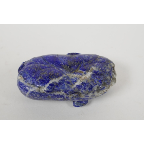 210 - A Chinese carved lapis lazuli pendant decorated with two monkeys, 8 x 5cm