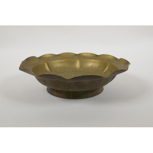 214 - A Chinese brass bowl with frilled rim, engraved dragon decoration, 21cm diameter