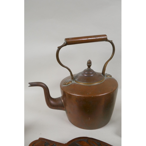 222 - A quantity of antique fireside items to include a copper kettle, cast iron and bronze trivets, irons... 