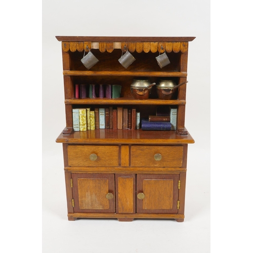 224 - A miniature mahogany Welsh dresser and contents, 26cm high