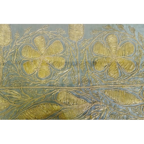 227 - An antique Islamic silk textile, with gilt thread embroidered decoration, 94 x 26cm