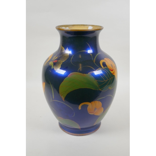 230 - An oriental iridescent blue glazed ceramic vase decorated with lilies, character mark to base, 32cm ... 