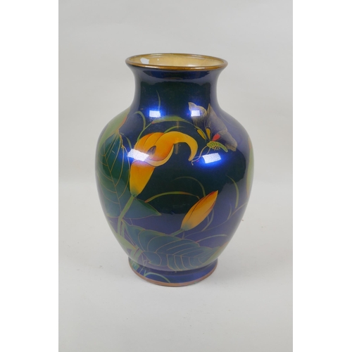 230 - An oriental iridescent blue glazed ceramic vase decorated with lilies, character mark to base, 32cm ... 