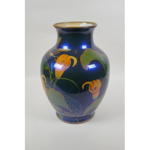 230 - An oriental iridescent blue glazed ceramic vase decorated with lilies, character mark to base, 32cm ... 