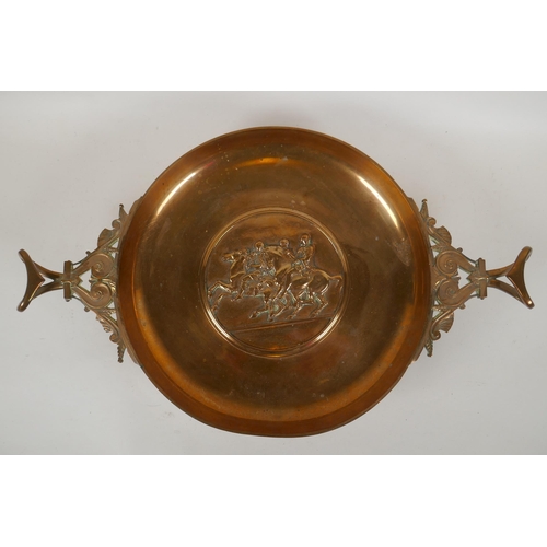 236 - A Barbedienne bronze tazza, the centre embossed with horses and riders, the handles supported on Bac... 