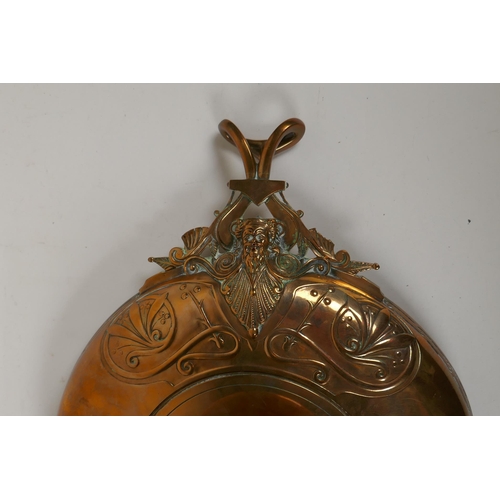 236 - A Barbedienne bronze tazza, the centre embossed with horses and riders, the handles supported on Bac... 